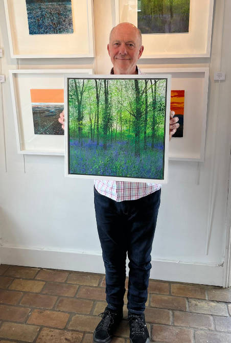 Paul holding the painting